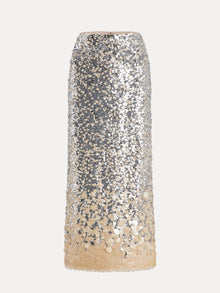 The Social Queen Ombre Silver & Gold Sequin Slim Skirt features a mid-length design embellished with large, shimmering sequins for a striking, reflective look.
