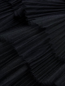 Close-up of the Organza Pleated Skirt by Social Queen, showcasing its detailed black pleated texture and elegant layered design.