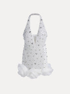 The Social Queen Pearl-Crystal Embellished Floral Hem Mini Dress features a white halter design, deep V neckline, pearl details, and large fabric flowers at the hem.