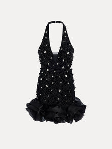 The Social Queen Pearl-Crystal Embellished Floral Hem Mini Dress features a black halter-neck design with crystals, beads, pearls, a deep V neckline, and a ruffled floral hem.