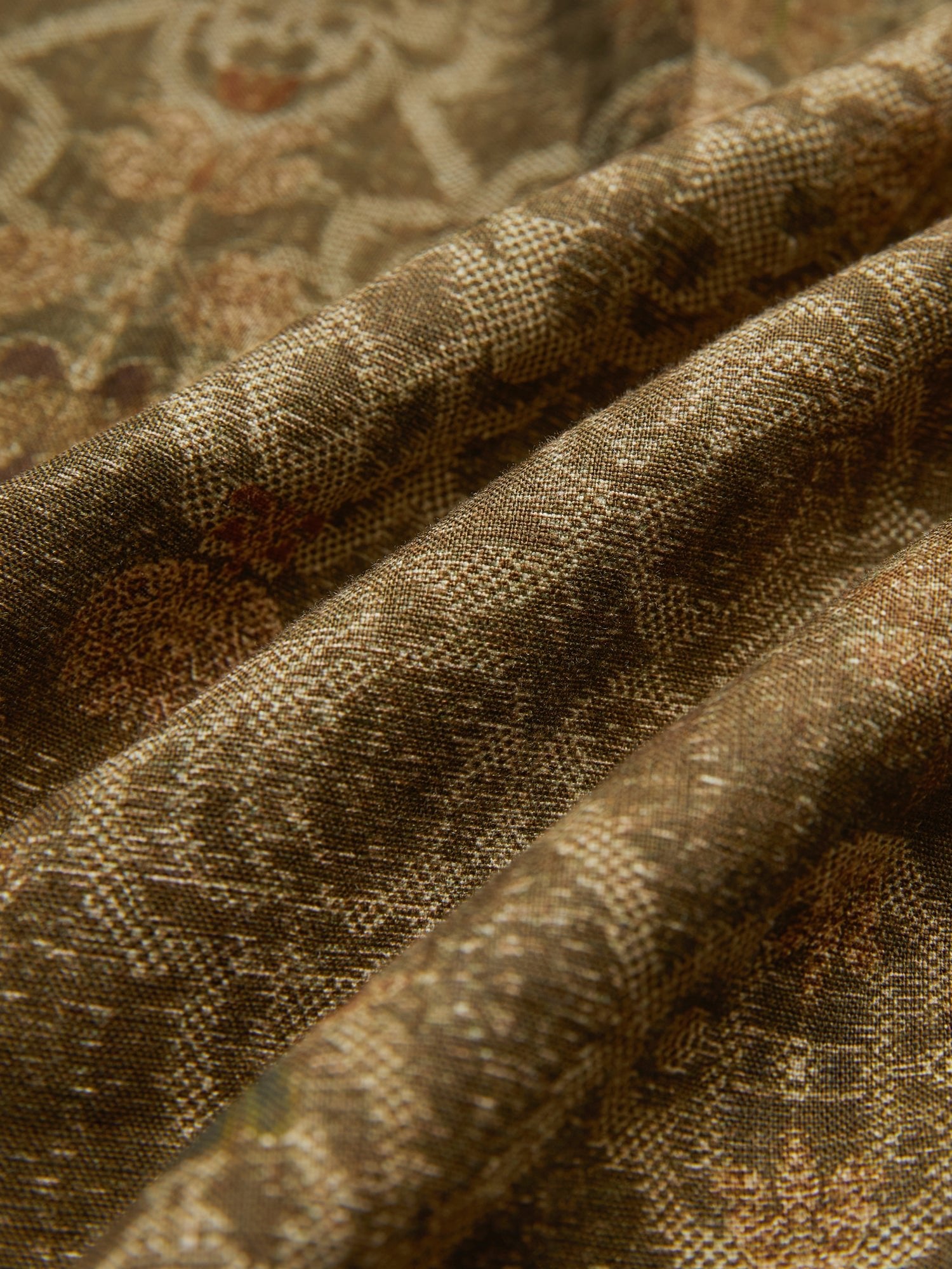 Close-up of Social Queen's Printed Linen Blouse shows its intricate woven pattern and visible texture in gentle folds, making it perfect for an artisanal look.