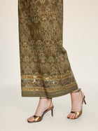 A person wearing Social Queen Printed Linen Straight-Leg Pants and metallic gold high-heeled sandals stands against a neutral background.
