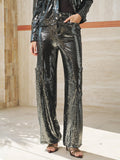 A person models Social Queen’s Sequin-Embellished Wide-Leg Pants with a matching black sequin jacket and open-toe heels, standing indoors against a neutral backdrop.