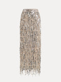 The Social Queen Sequin Fringe Side-Slit Midi Skirt features a high waist and fringe trim, shown against a plain white background.