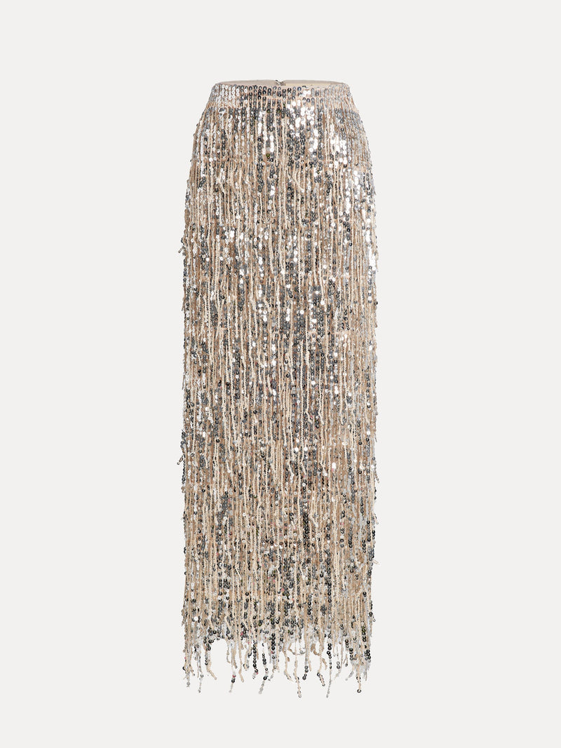 The Social Queen Sequin Fringe Side-Slit Midi Skirt shines in silver sequins and vertical fringe, perfect for cocktail evenings. Displayed against a white background, its high waist and slit create an elegant, sparkling look.