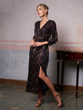 A woman wearing the Social Queen Sequin Fringe Slit Evening Gown stands indoors beside a small wooden table, looking to the side.