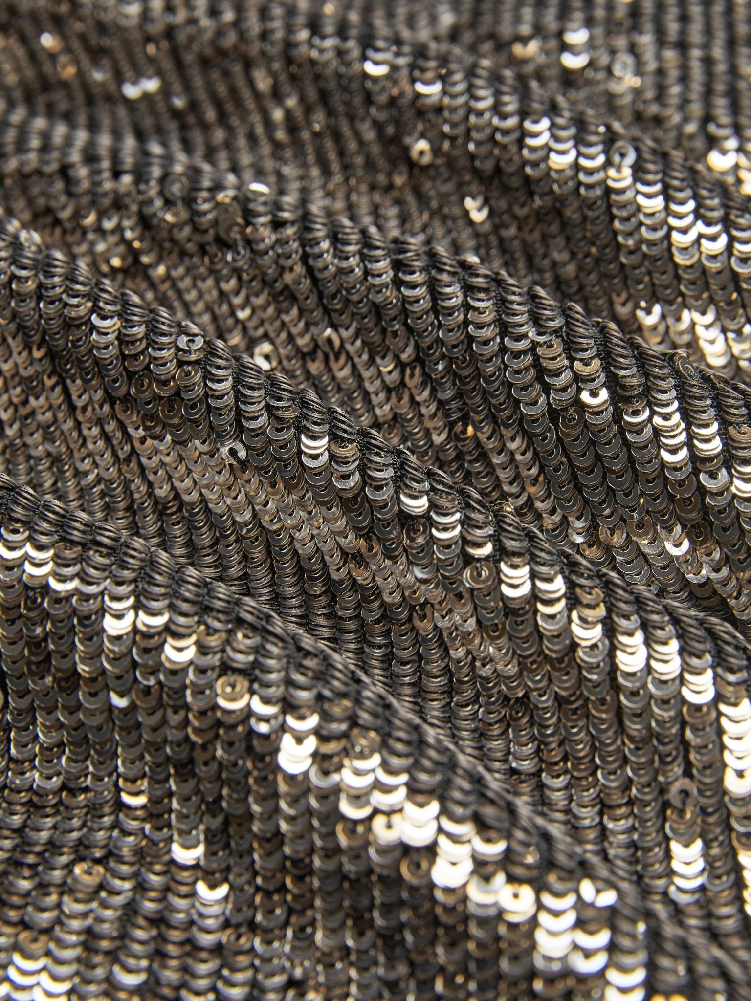 Close-up of Social Queen's Sequin High-Waist Wide-Leg Pants, featuring textured fabric densely covered in shiny metallic sequins that reflect light for a rippled, statement look—perfect party pants.