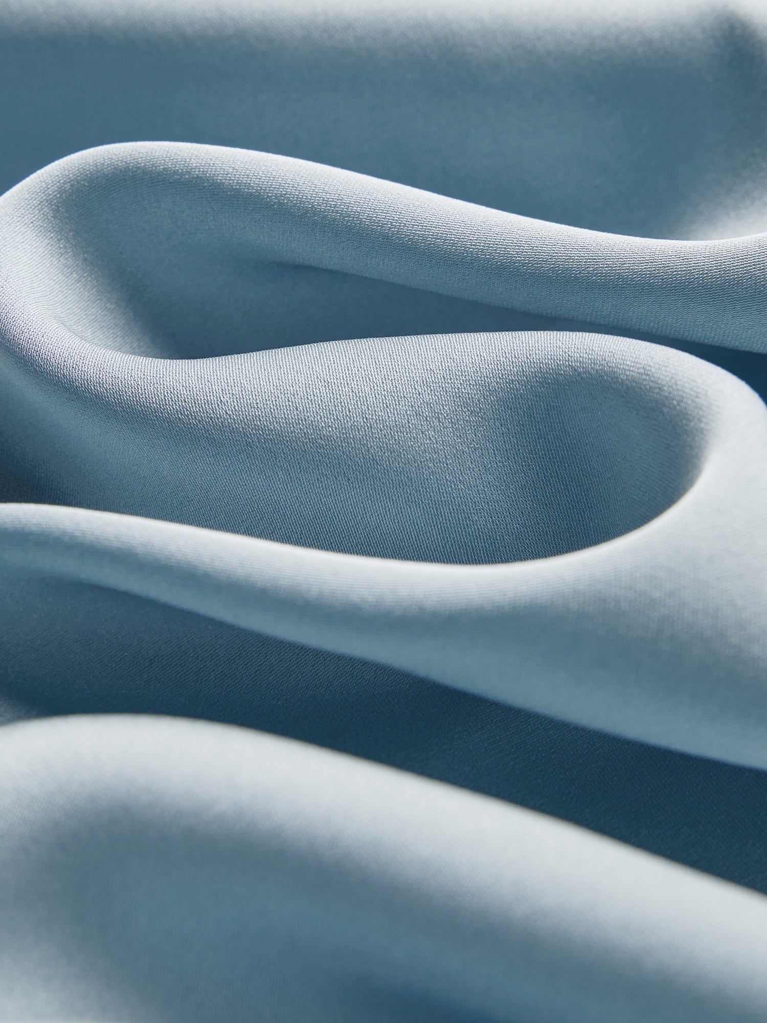 Close-up of the Social Queen Silk Satin Shirt with Lace Trim, featuring soft light blue fabric, smooth texture, and elegant hand-stitched lace detailing.