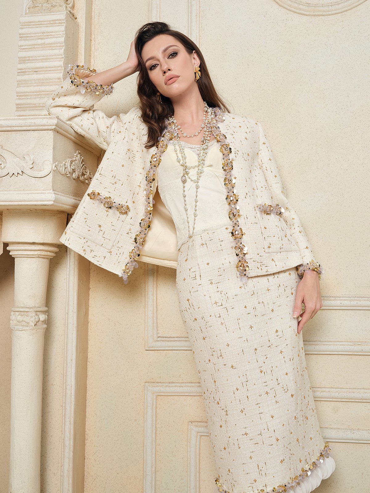 A woman models the Social Queen Stretch Velvet Camisole with Embossed Lace indoors, standing against an ornate wall and fireplace.