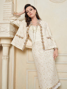 A woman models the Social Queen Stretch Velvet Camisole with Embossed Lace indoors, standing against an ornate wall and fireplace.