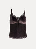 The Stretch Velvet Camisole with Embossed Lace by Social Queen features vintage-inspired styling, thin straps, velvet cups, a lace neckline, a center bow, and scalloped lace trim at the hem.