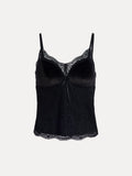 The Social Queen Stretch Velvet Camisole with Embossed Lace features a vintage-inspired design, delicate lace neckline, thin adjustable straps, scalloped trim, and a center front bow detail.