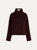 The Social Queen Wool-Cashmere Cropped Wrap Jacket features a dark burgundy hue, long sleeves, a collar, an asymmetric front closure, and a single visible button.