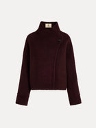 The Social Queen Wool-Cashmere Cropped Wrap Jacket features a dark burgundy hue, long sleeves, a collar, an asymmetric front closure, and a single visible button.