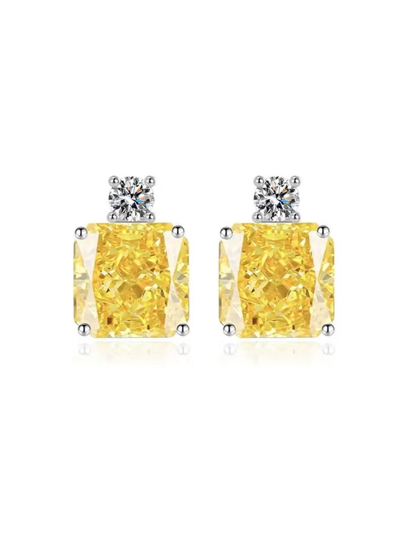 The Yellow Crystal Stud Earrings by Social Queen feature square yellow gems in white gold–plated silver, accented with small round clear stones above each.